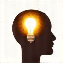 An icon of a lightbulb inside a human head silhouette.